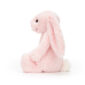 Bashful pink bunny soft toy by Jellycat, side view.